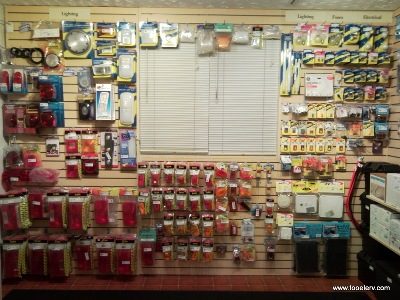 RV lighting, fuses and electrical parts on the retail wall
